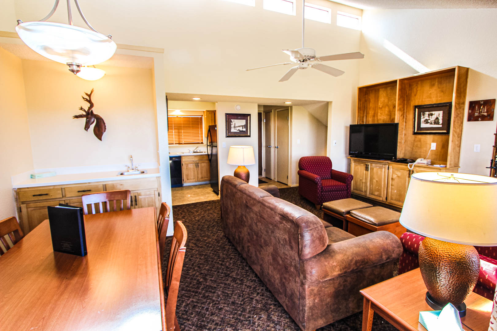 A roomy living and dining room area at VRI's Crown Point Condominiums in New Mexico.